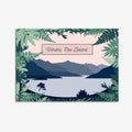 A greeting card featuring a modern landscape design with a view of a lake and mountains, and text 'Wanaka, New Zealand'. It is bordered by native ferns and includes a white envelope.