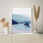 The Bridget Hall Designs Wanaka Tree Vertical Art Print in a frame on a shelf next to plants