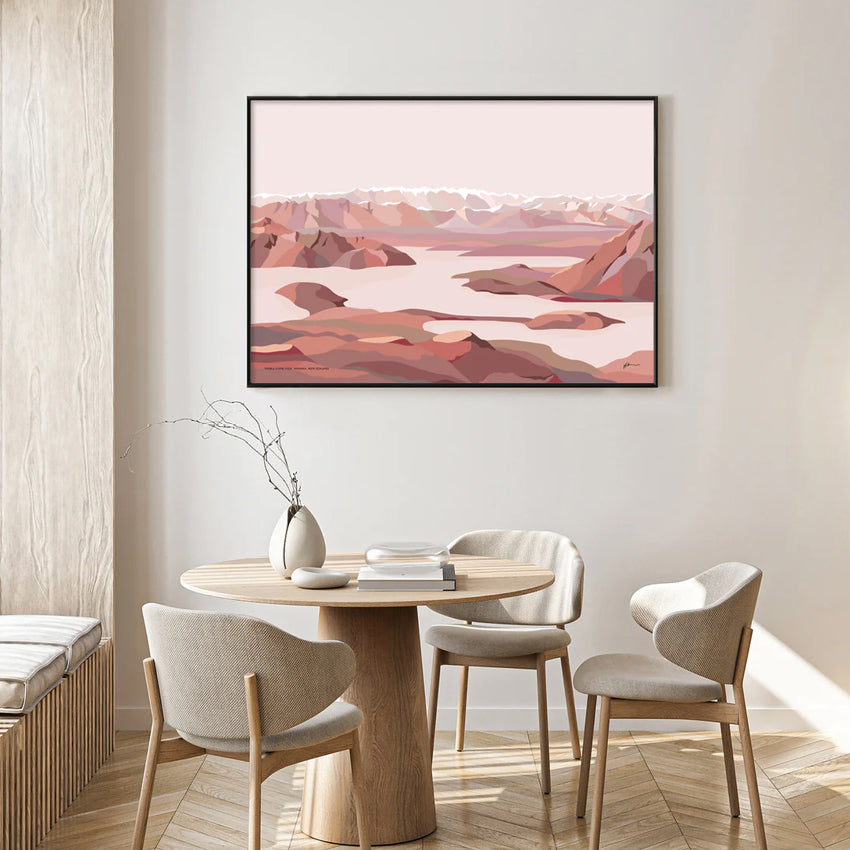 The Bridget Hall Design Treble Cone View Art Print in a black frame hanging above a dining table