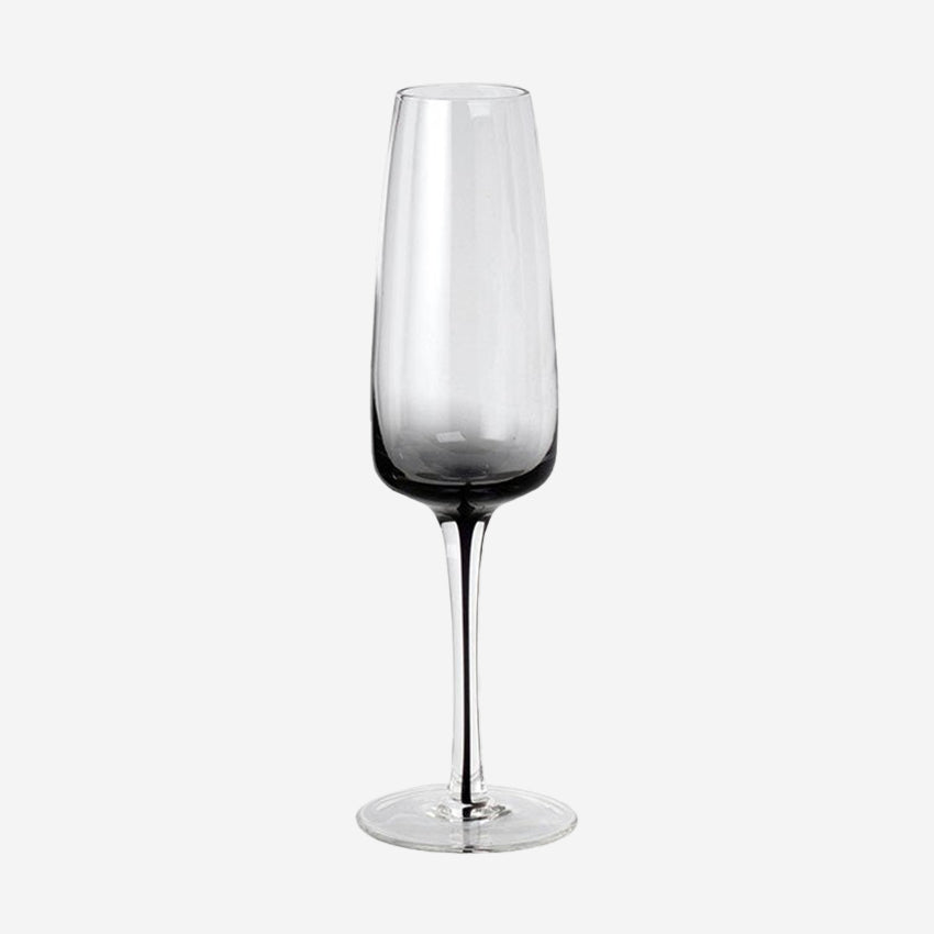 The Broste Copenhagen Champagne Glass in Smoke on a blank background