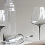 The Broste Copenhagen Red Wine Glass in Smoke with other Broste Glassware