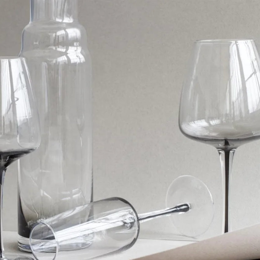 The Broste Copenhagen Red Wine Glass in Smoke with other Broste Glassware