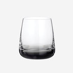 The Broste Copenhagen Short Tumbler Glass in Smoke on a blank background