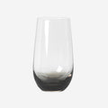 The Broste Copenhagen Tall Tumbler Glass in Smoke on a blank background