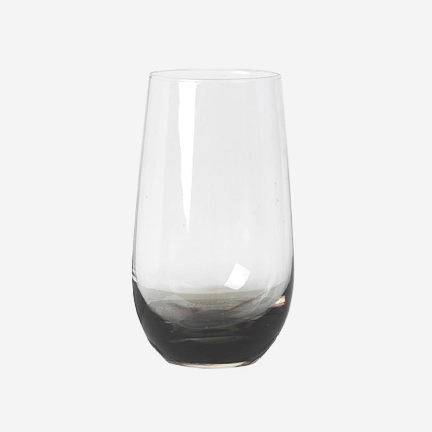 The Broste Copenhagen Tall Tumbler Glass in Smoke on a blank background