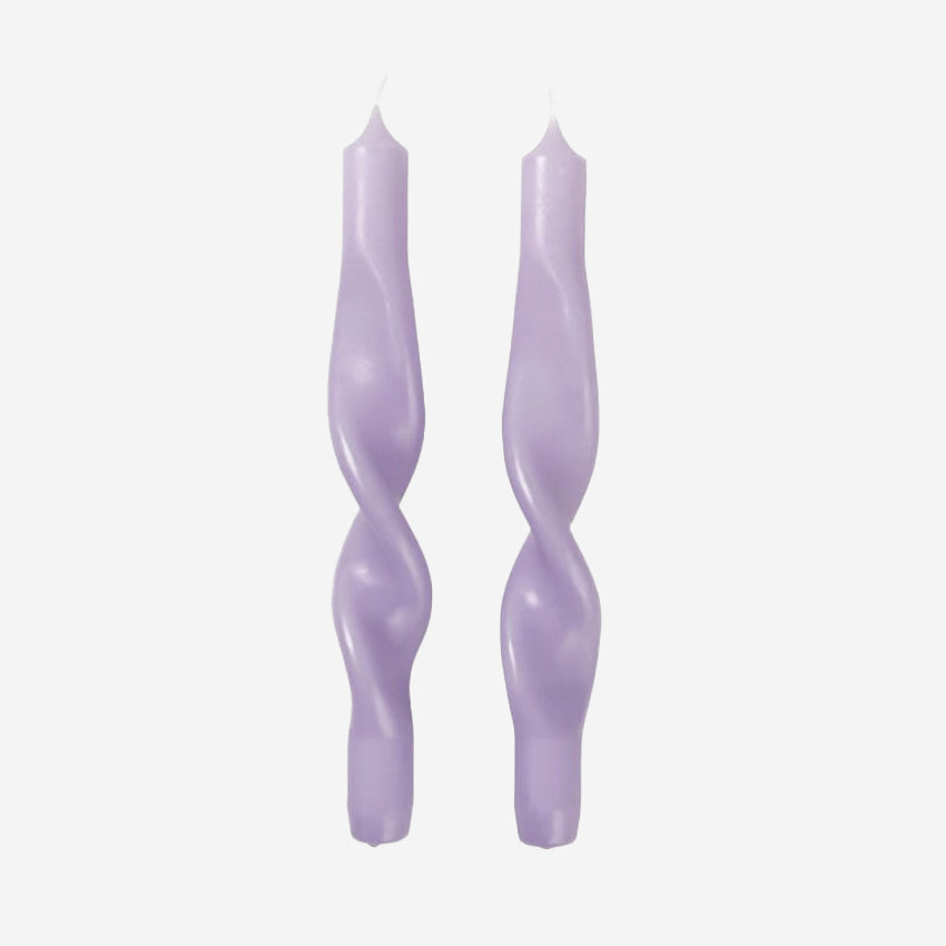 The Broste Copenhagen Twist Candles in Orchard Light Purple on a blank background