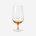 The Broste Copenhagen Beer Glass in Amber on a blank background