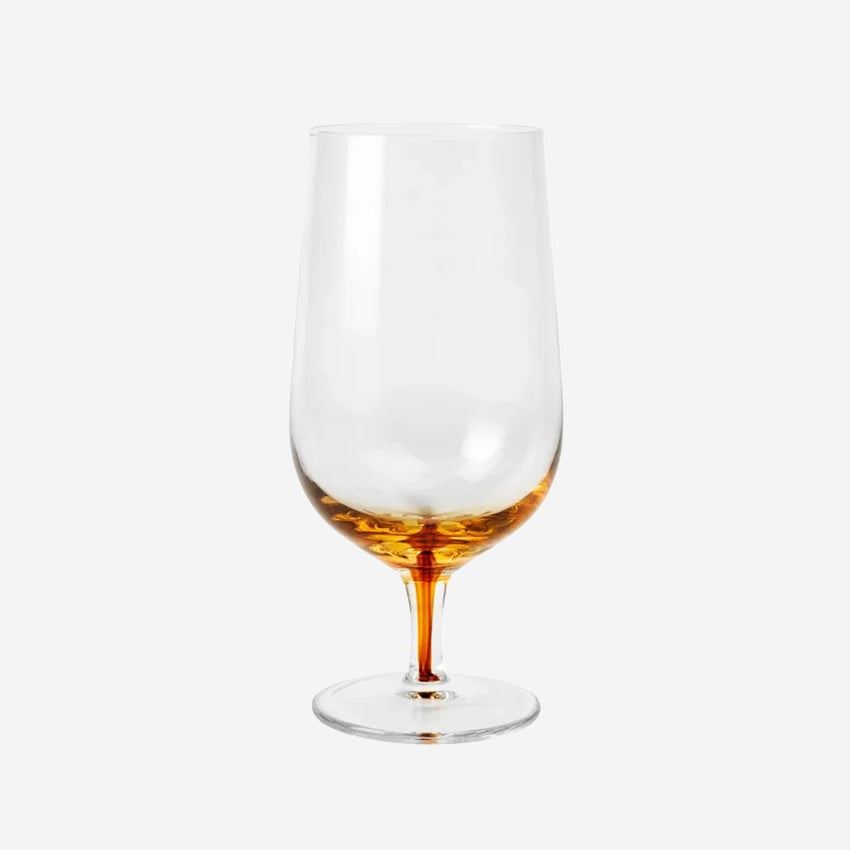 The Broste Copenhagen Beer Glass in Amber on a blank background