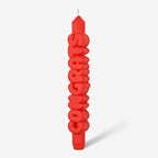 Candle Hand Congrats 3D Taper Candle in orange on a grey background