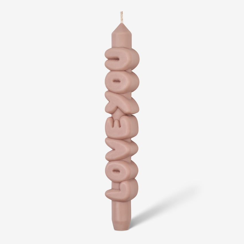 The CandleHand Love You 3D Taper Candle in cream on a grey background