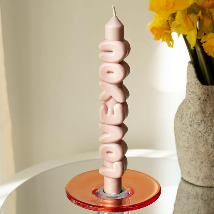 The CandleHand Love You 3D Taper Candle in cream in a glass candle holder