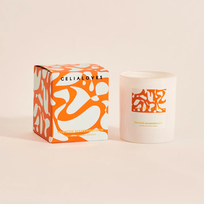 The Celia Loves Toasted Marshmallow Candle with its box