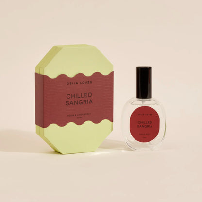 The Celia Loves Chilled Sangria Room and Linen Spray with it's box on a blank background