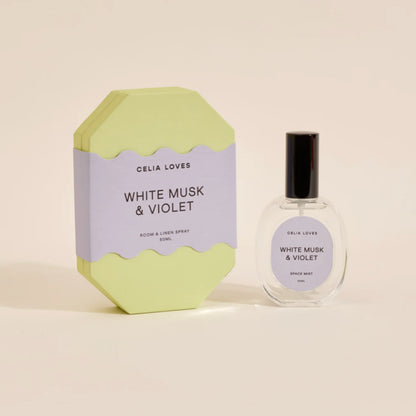 The Celia Loves White Musk and Violet Room and Linen Spray with it's box on a blank background