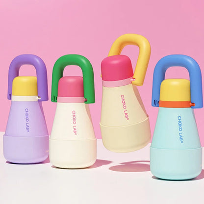 The Chako Lab Tata Thermos Cup in a range of colours on a pink background
