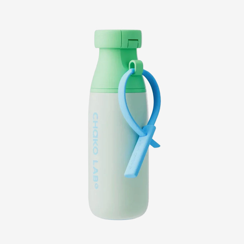 The Chako Lab Milk Mate Tumbler in Mint Green on a grey background