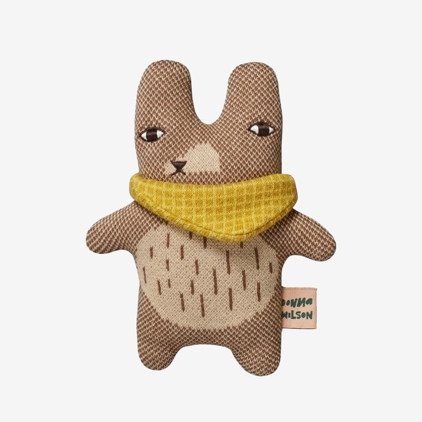 The Donna Wilson Wee One Teeny Ted on a grey background