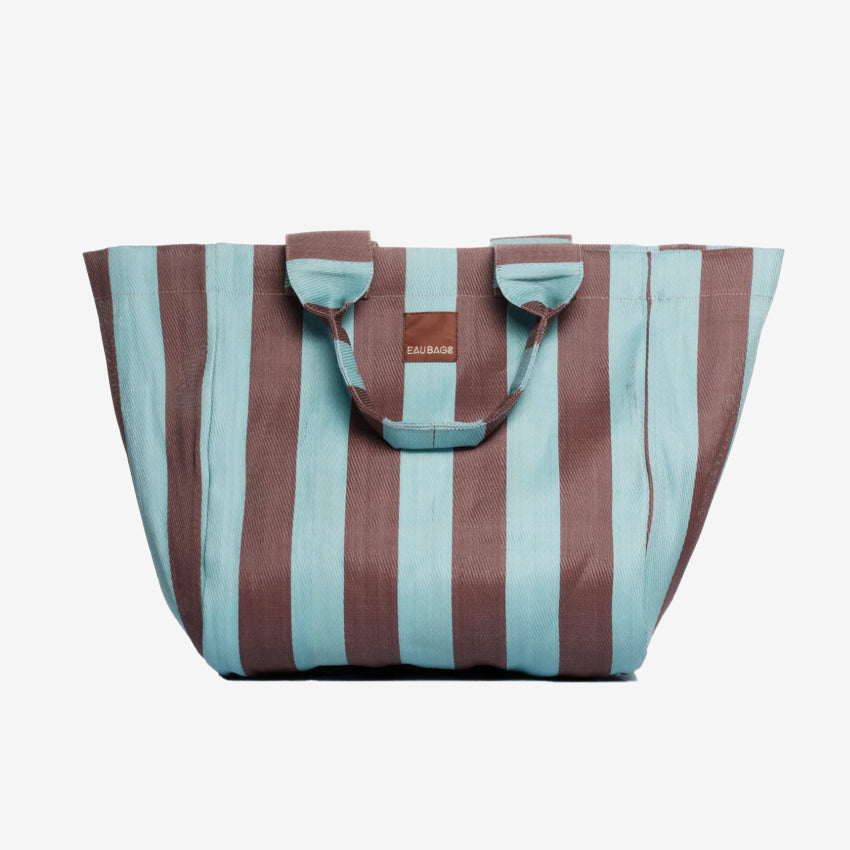 The EAU Grand Bag in Iced Chocolate on a grey background