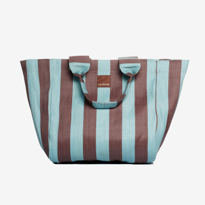 The EAU Grand Bag in Iced Chocolate on a grey background