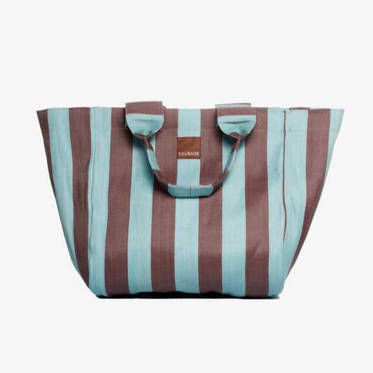 The EAU Grand Bag in Iced Chocolate on a grey background