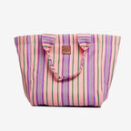 The EAU Grand Bag in Wild Clay on a grey background