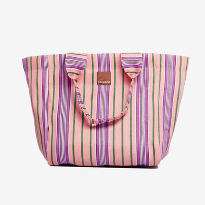 The EAU Grand Bag in Wild Clay on a grey background