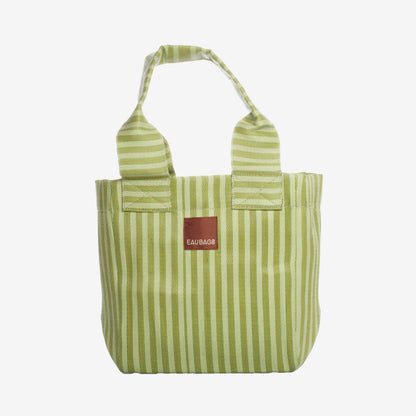 The EAU Tote Bag in Kiwi on a grey background