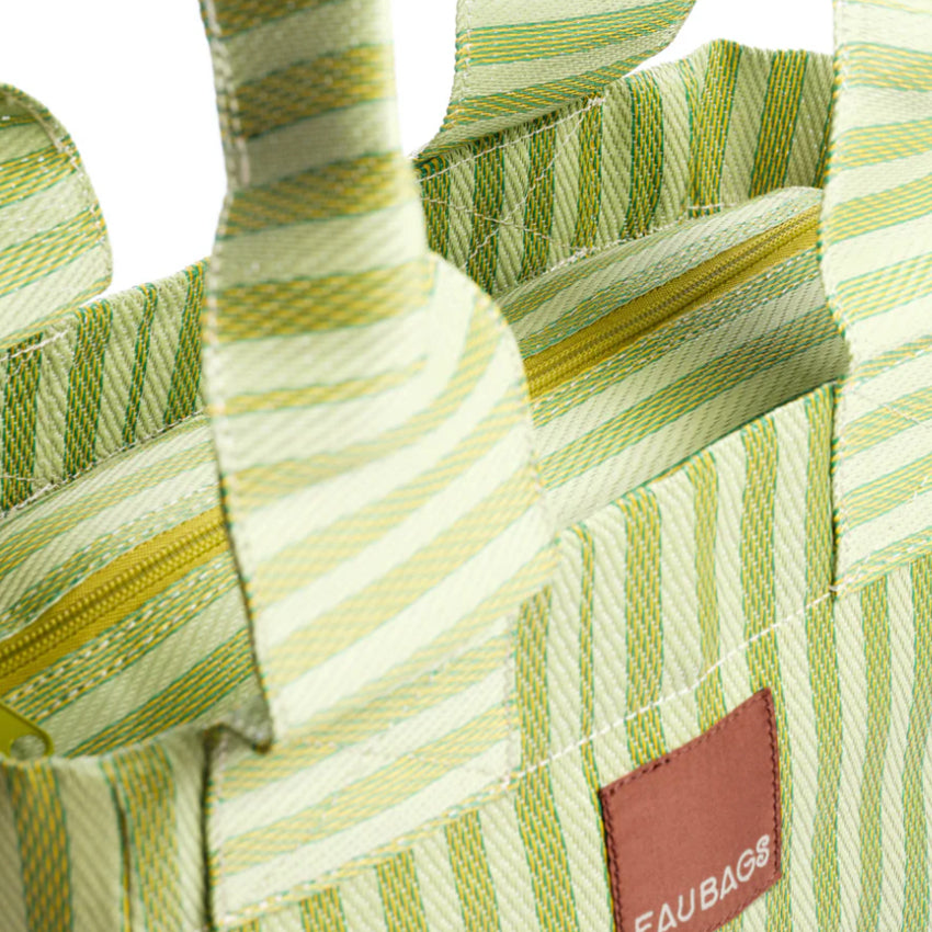 A closeup of the EAU Tote Bag in Kiwi 