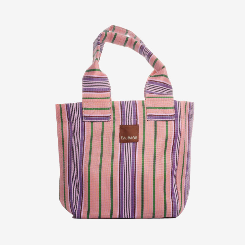 The EAU Tote Bag in Wild Clay on a grey background