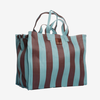 The EAU Vacay Bag in Iced Chocolate on a grey background