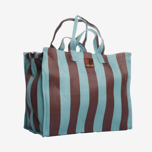 The EAU Vacay Bag in Iced Chocolate on a grey background