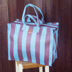 The EAU Vacay Bag in Iced Chocolate on a  stool