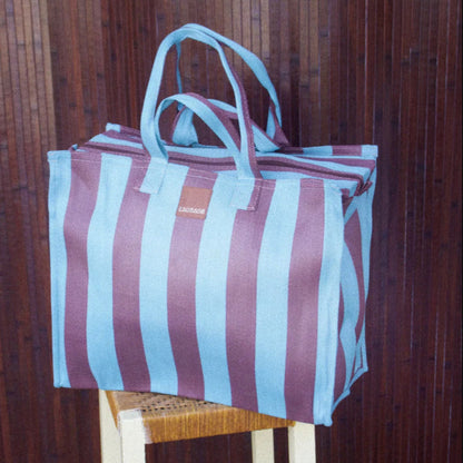 The EAU Vacay Bag in Iced Chocolate on a  stool
