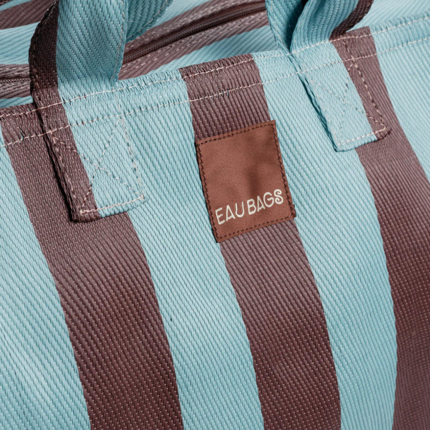 A closeup of the EAU Vacay Bag in Iced Chocolate