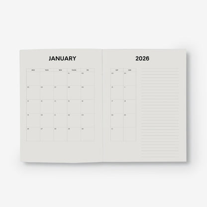 Open planner showing the monthly layout with a white background