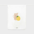 The Father Rabbit Tea Towel in the Jug with Lemon design hanging on a rod