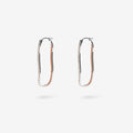 The Nina Gordon Fiasco Paved Hoops in Silver on a blank background