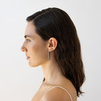 The Nina Gordon Fiasco Paved Hoops in Silver on a model