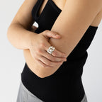 The Nina Gordon Volume Chain Ring in Silver on a models finger