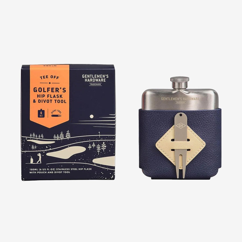 The Gentlemen's Hardware Golfers Hip Flash next to its box on a grey background