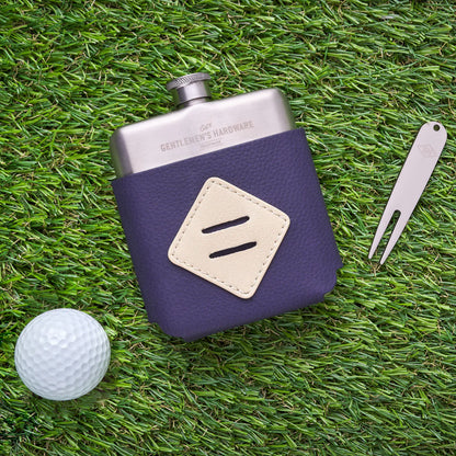 The Gentlemen's Hardware Golfers Hip Flash on grass next to the divot tool and a golf ball