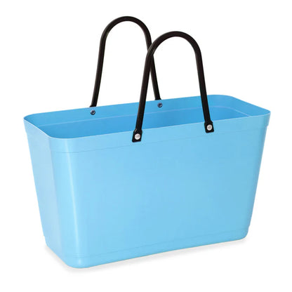 The Hinza Bag in Light Blue on a white background