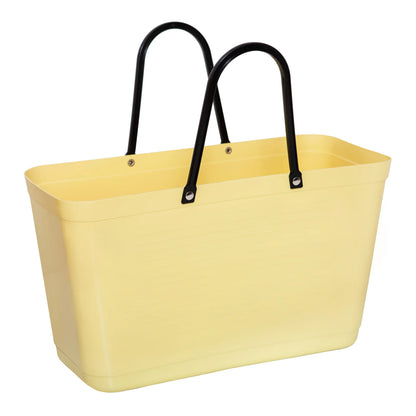 A yellow Hinza Bag on a white background