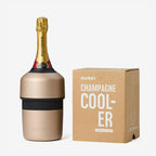 The Huski Champagne Cooler in Champagne with a champagne bottle in it next to its box on a blank background