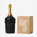 The Huski Champagne Cooler in Black with a champagne bottle in it next to its box on a blank background