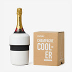 The Huski Champagne Cooler in White with a champagne bottle in it next to its box on a blank background