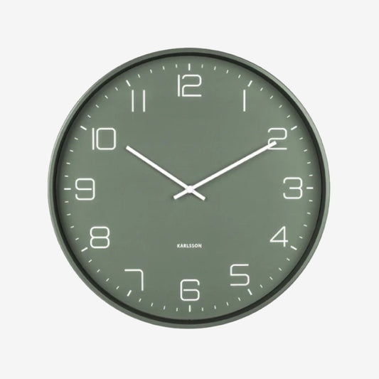 The Karlsson Lofty Wall Clock in Matte Green on a grey background