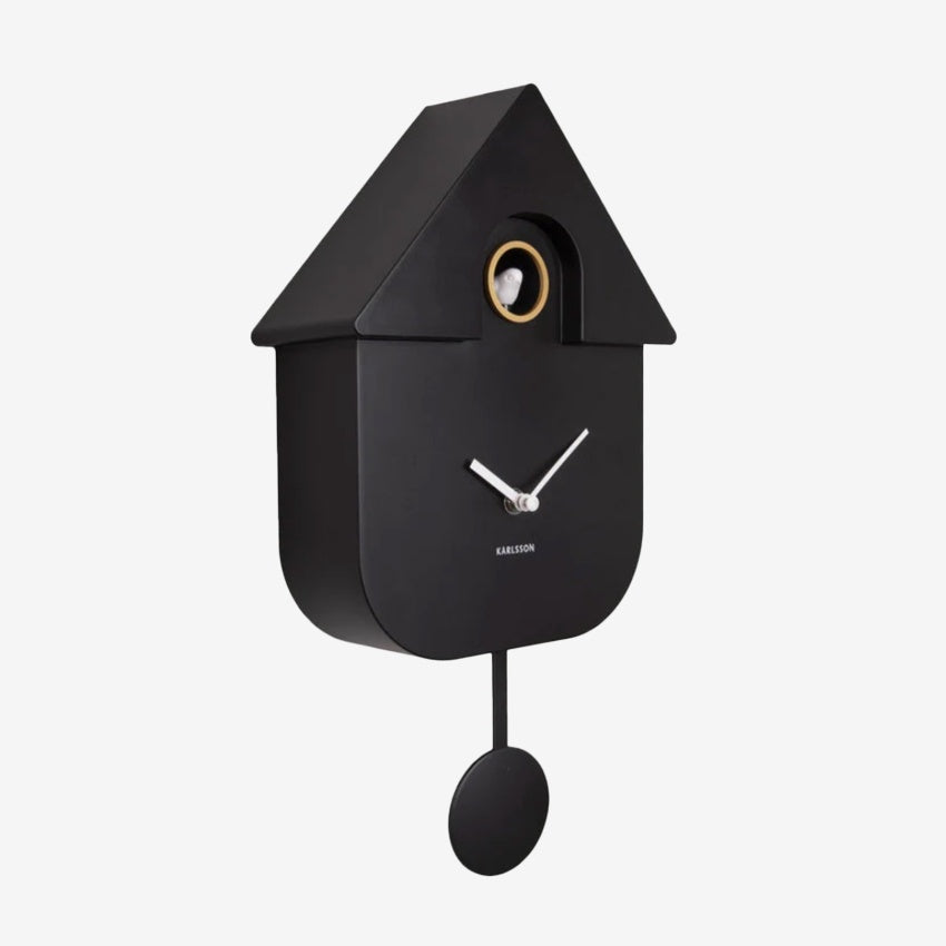 The Karlsson Modern Cuckoo Clock in Black on a grey background