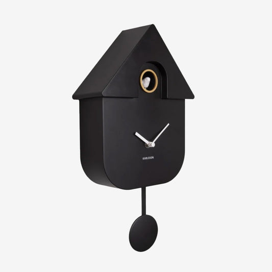 The Karlsson Modern Cuckoo Clock in Black on a grey background