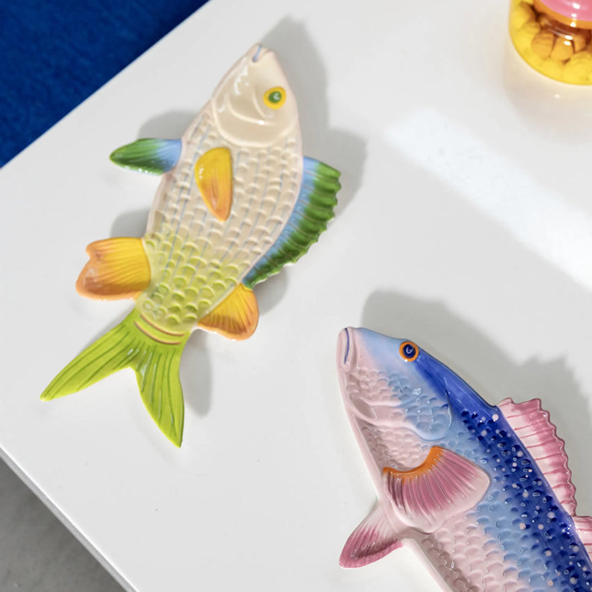 The &Klevering Trigger and Perch Fish Plates on a white table